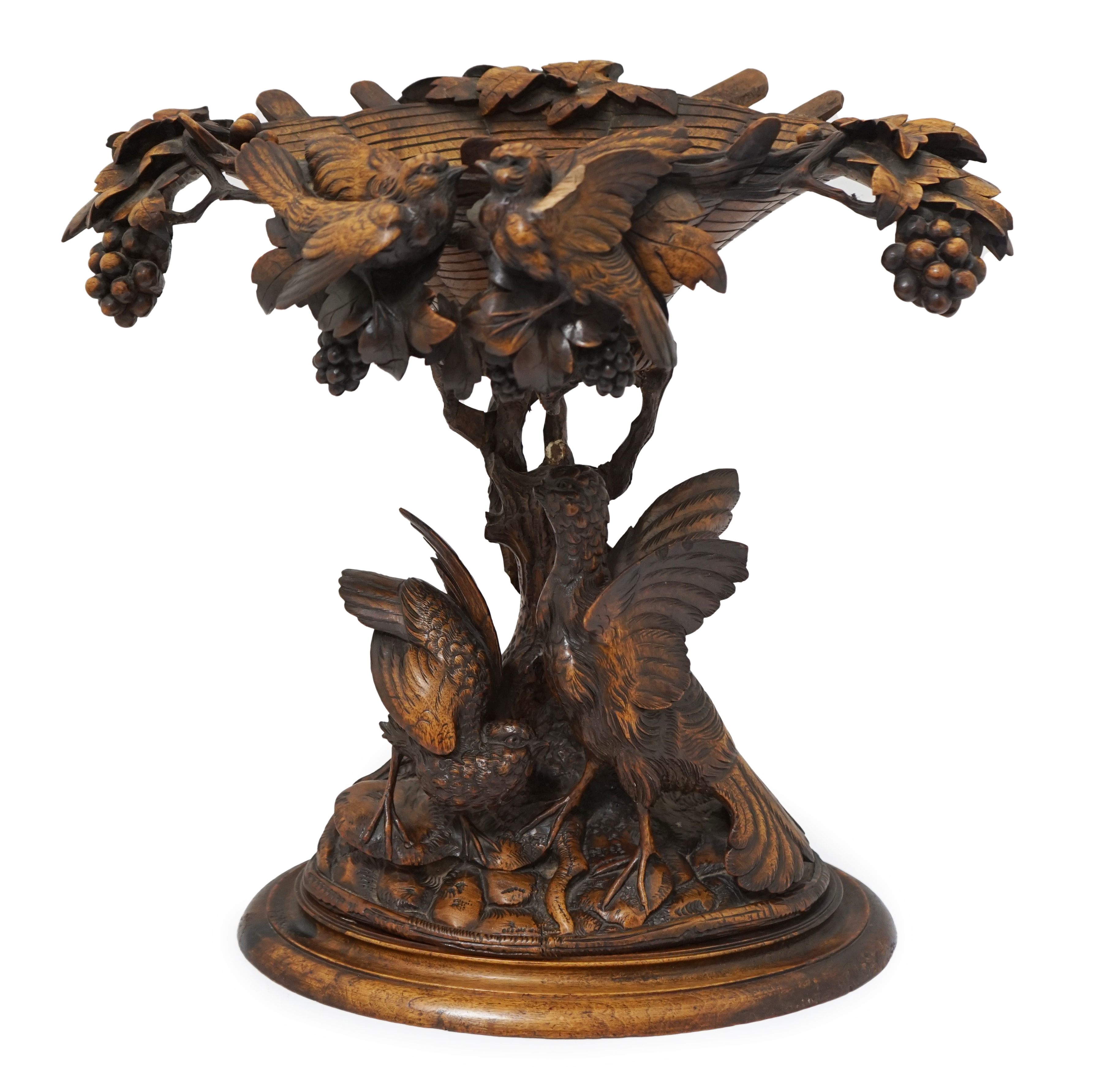 A 19th century Black Forest carved wood centrepiece